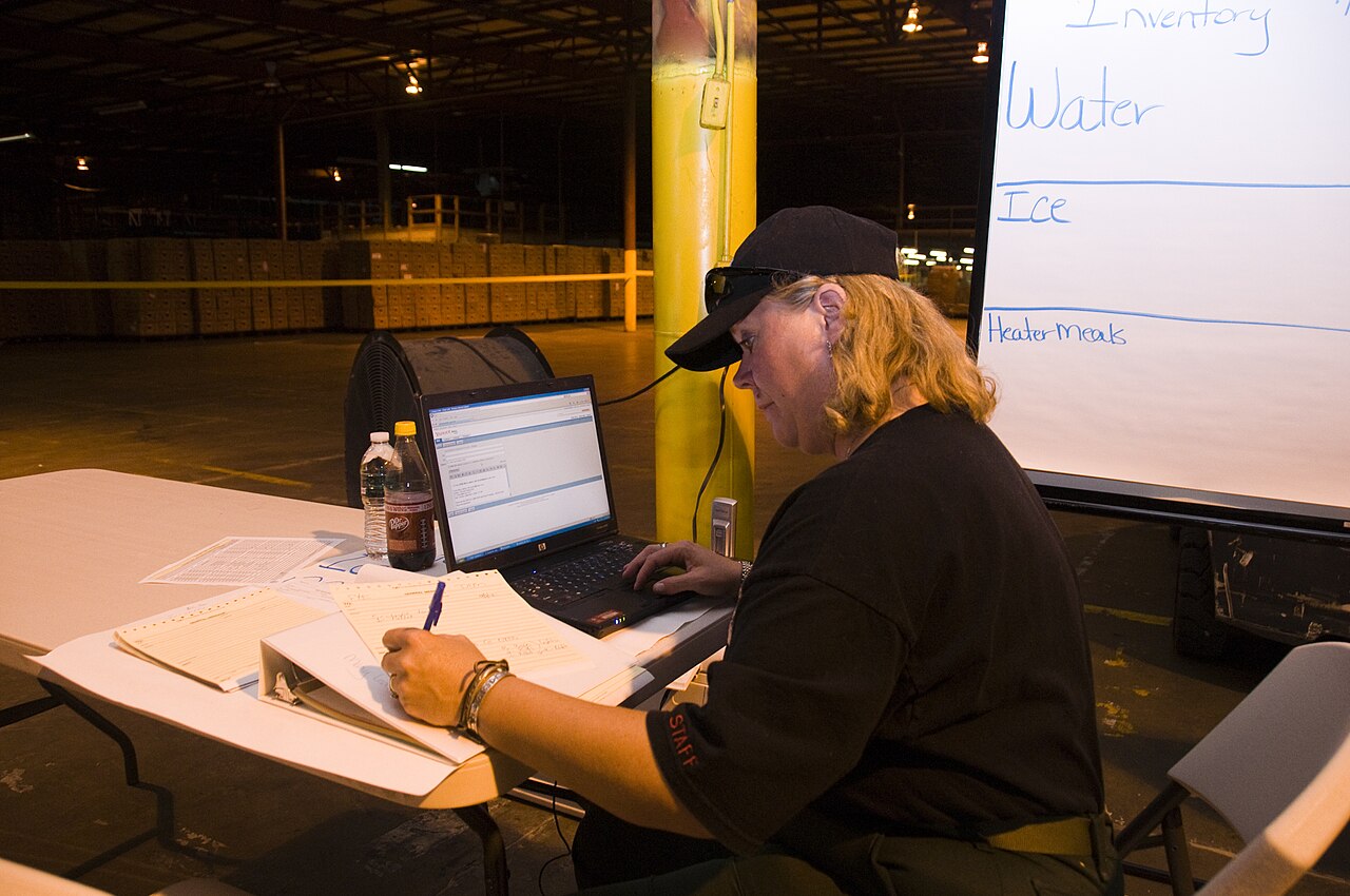 Worker using a computer in a warehouse